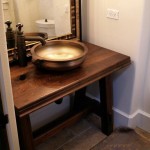 Walnut face grain reproduction wood vanity top and base.  Distressed with Waterlox Satin finish.